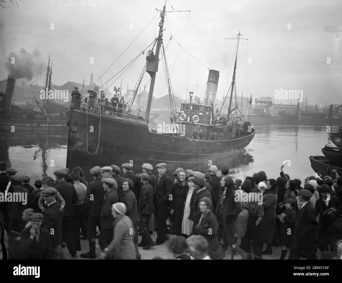 The trawler  Lord Talbot  arrives at Aberdeen . A great welcome awaited the British trawler  Lord Talbot  when she arrived at Aberdeen after rescuing the  Flying Family  , Mr and Mrs George Hutchinson , their two children , and the other four members of the crew off the coast of Greenland , after they had crashed in the plane  Flying Family  on their Atlantic flight . The crowd on the shore cheering the  Lord Talbot  as she arrived in Aberdeen . 22 September 1932 Stock Photo