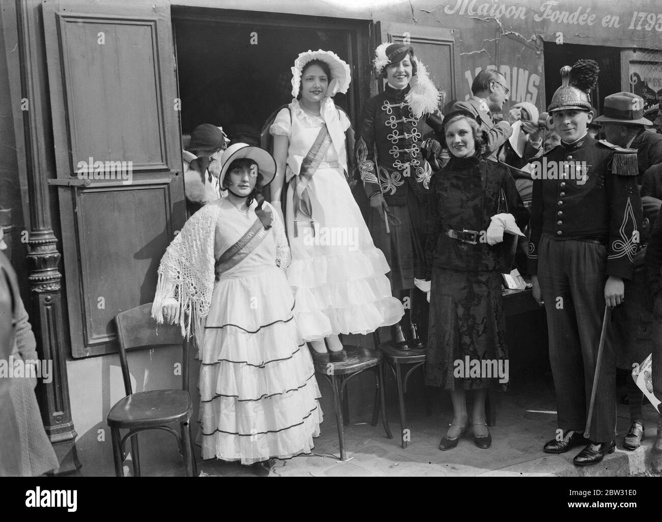 Crinoline fashions at Montmartre bicycle race . Crinoline fashions worn by sightseers at the Paris Newspaper boys bicycle race round Paris . 20 March 1932 Stock Photo