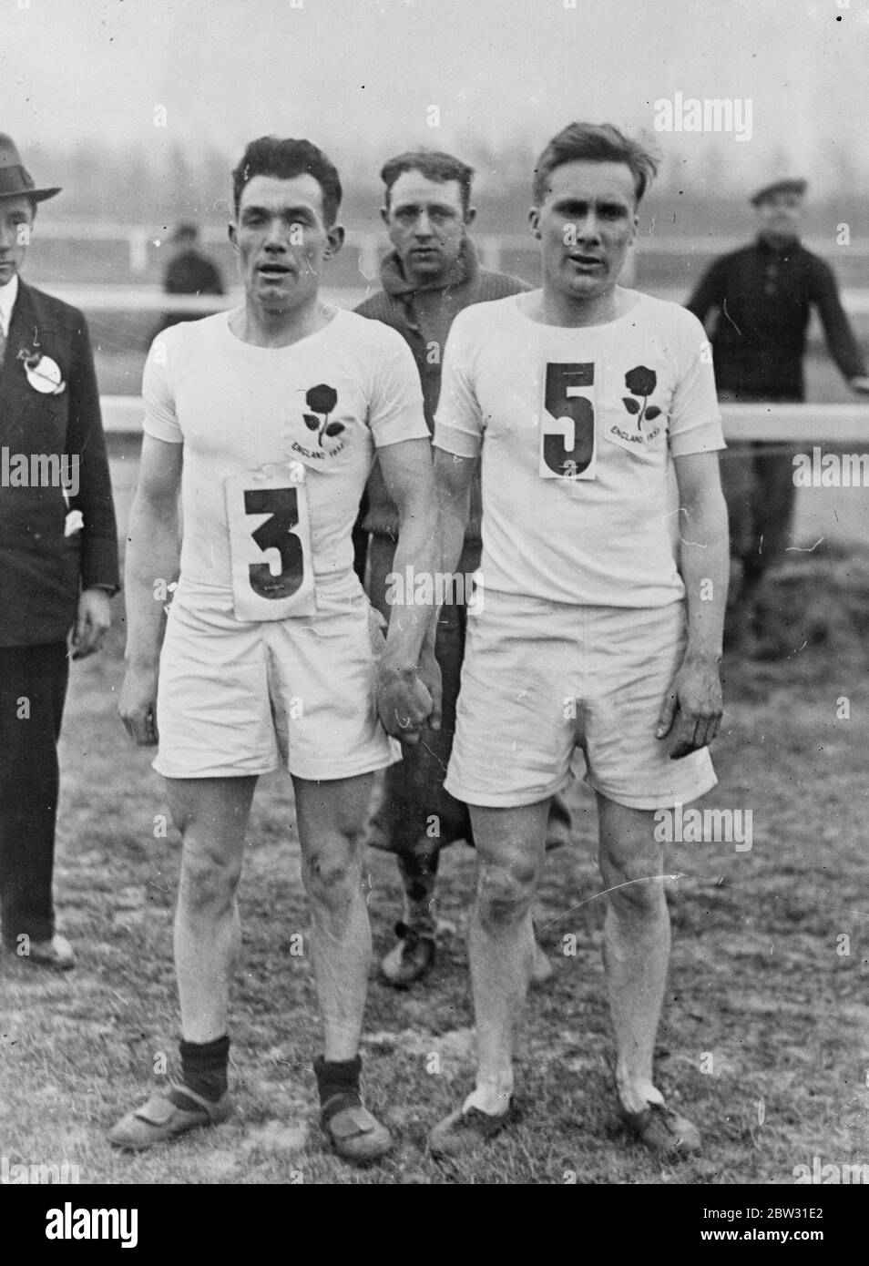Britain wins international cross country race in Belgium . England made a clean sweep of the international cross country race at Brussels , the first six men home being English . France was second , Scotland third , Belgium fourth . Wales fifth and Ireland sixth . The King of the Belgians , who was among the spectators , congratulated the team on their success . T Evenson of Salford Harriers who was first home , with J T Holden of Tipton Harriers , who was second , after their victory . 21 March 1932 . Stock Photo