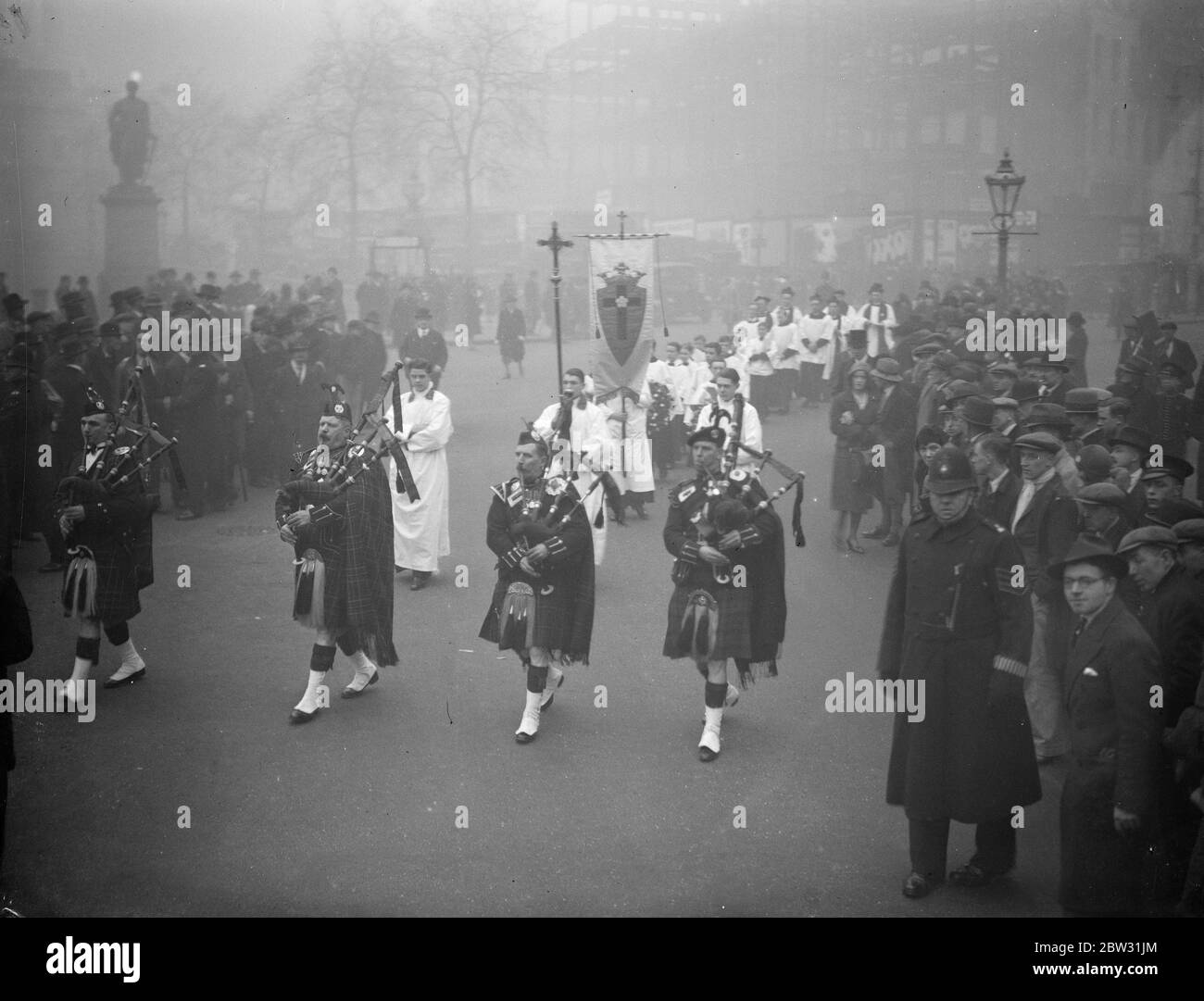 Stuart Adherents honour Martyr King . A commoration service for King Charles I  The Martyr King  who was beheaded on January 30th 1649 , took place in Trafalgar Square , when a wreath was laid on the King 's Statue by the Royal Stuart Society . The procession arriving at the statue , headed by pipers . 30 January 1932 Stock Photo