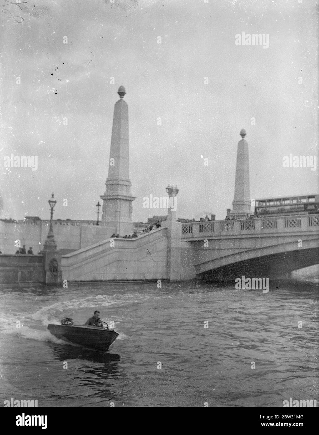 By speed boat to Antwerp . Mr R C Cole , the 21 year old London outboard motorboat enthusiast , in his outboard motorboat ' Miss Whitstable ' which is 13 feet long and has a 3 1/2 h.p engine , os attemptinga lone trip to Antwerp . He recently successfully completed completed the 550 miles journey from Westminster Bridge to Paris . Mr R C Cole at the wheel of his motorboat speeding in the Thames before the start of his trip . 4 August 1932 Stock Photo