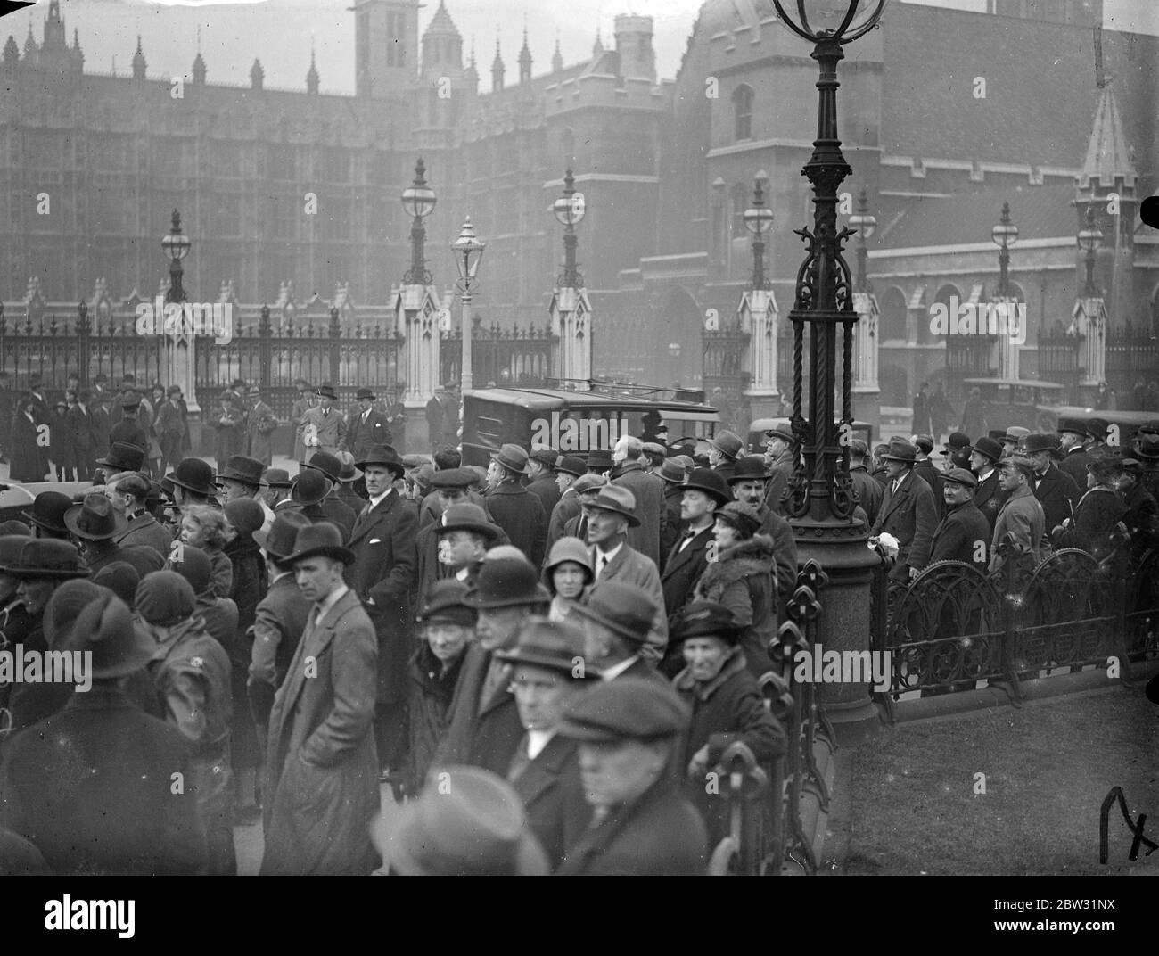 Crowds wait outside parliament for hours to see Chancellor arrive with his budget . 19 April 1932 . Stock Photo