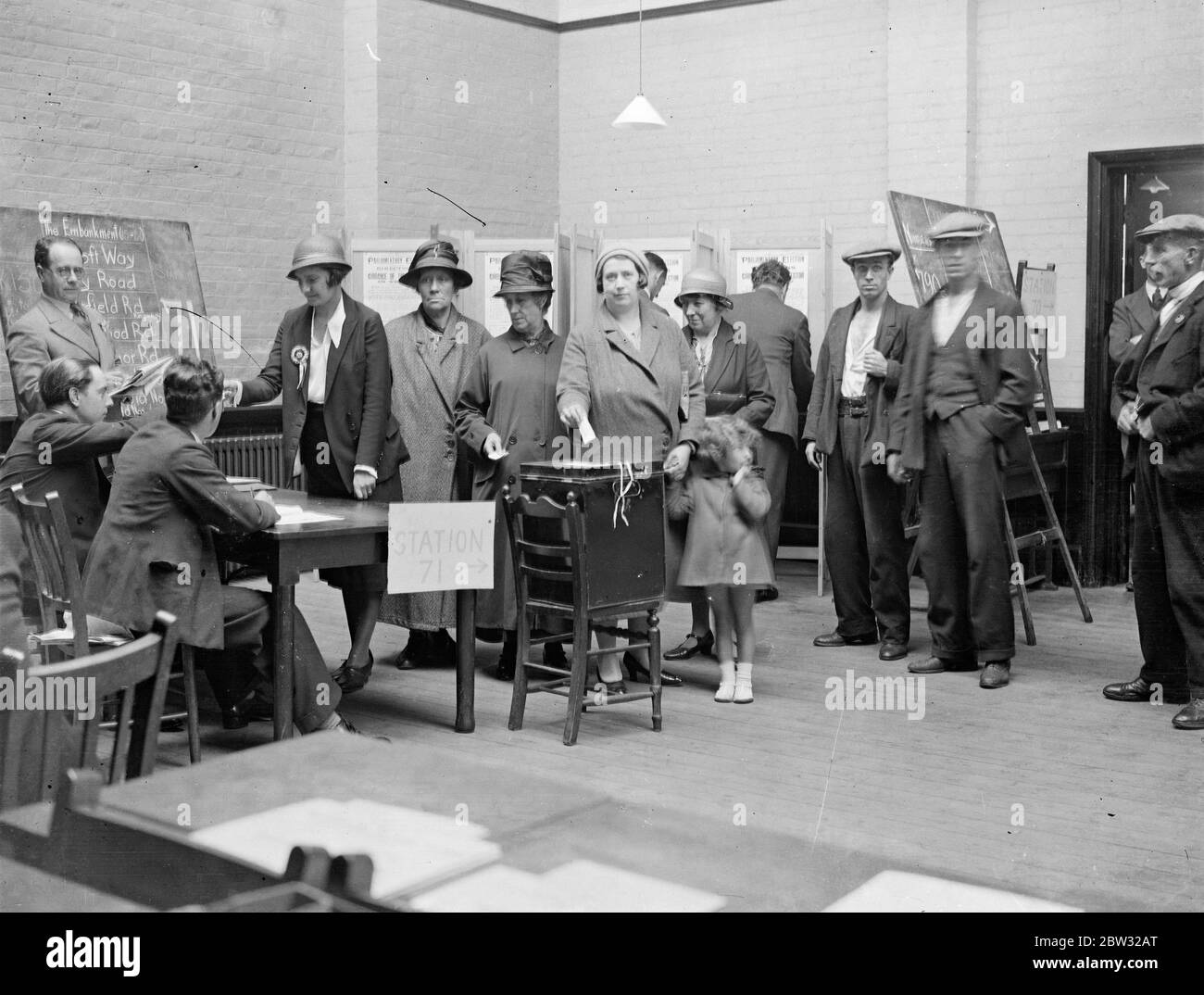 Polling begins at Twickenham by election . Polling was begun in the Twickenham by election , where Mr Percy Holman in representing the Labour interests , and Mr Murray Philipson , the Conservatives . A scene inside the polling booth at St Mary 's School , Arragon Road , Twickenham . 16 September 1932 Stock Photo