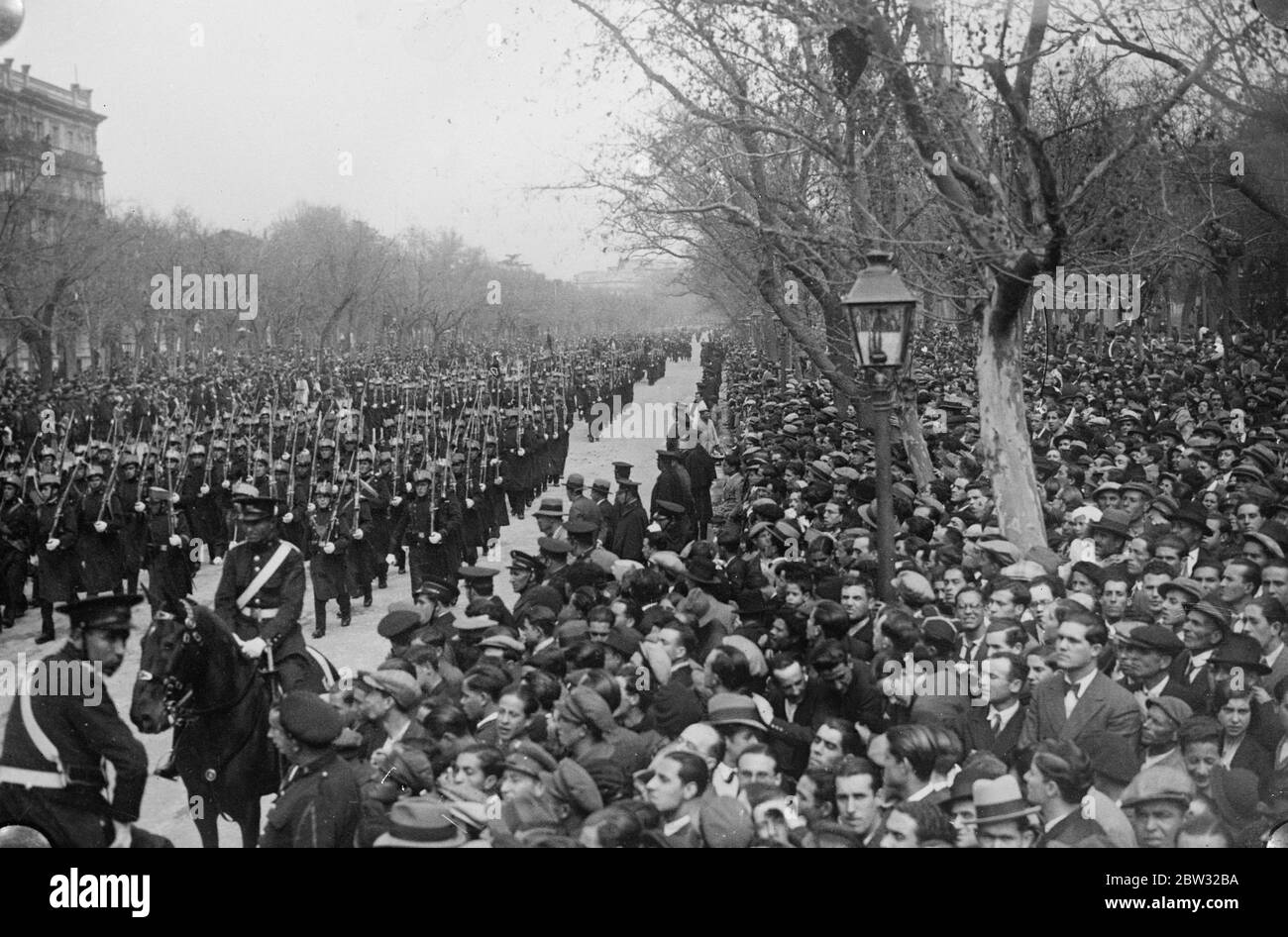 President reviews troops on first anniversary of proclamation of Spanish Republic . President Alcala Zamora , the Spanish President with members of the cabinet reviewed Spanish troops at a great parade held in Madrid to mark the first anniversary of the proclamation of the Spanish Republic . President Alcala Zamora , with the Cabinet Ministers reviewing the troops in Madrid at the celebrations . 19 April 1932 . Stock Photo