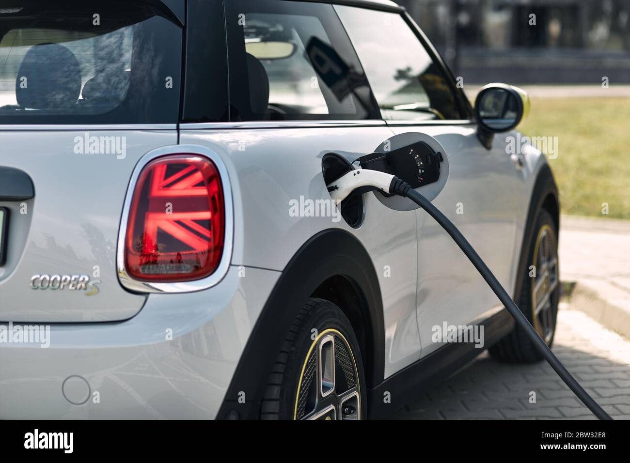 Katowice / Poland - 05.09.2020 : First fully electric Mini connected to a charging station. The Mini has a range of up to 230 km, 184 hp engine and ac Stock Photo