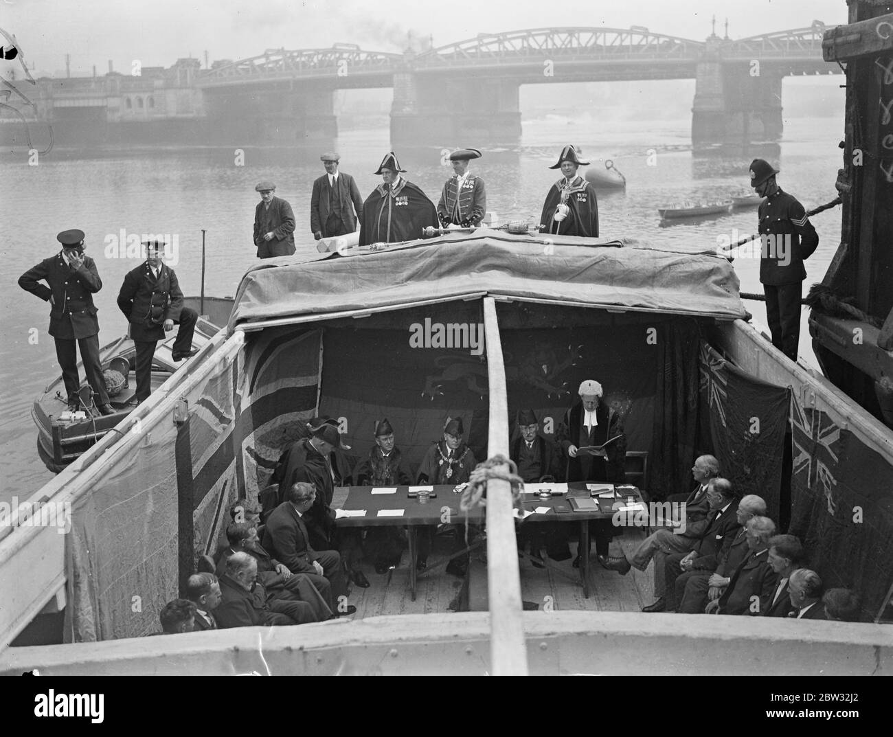 Court meets on river barge . One of the most picturesque courts in the country , the Medway Court of Admiralty , which is more than two hundred years old , met , according to custom , on a barge on the river Medway at Rochester . The Mayor , Councillor George Jenner , for the occasion became Admiral of the Medway . The Mayor addressing the Court . 9 July 1932 Stock Photo