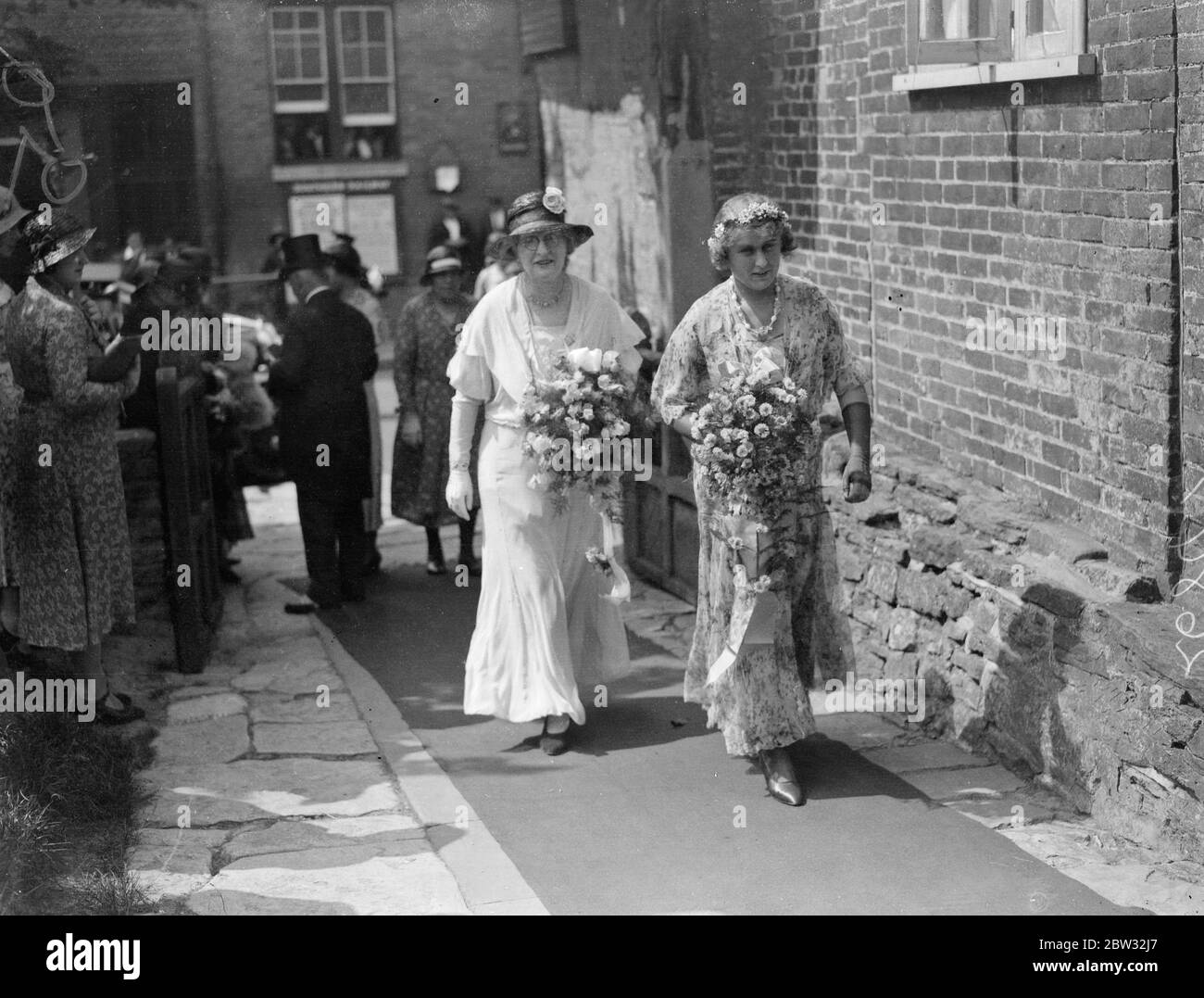 Heiress with veto on marriage acts as bridesmaid to her sister at staplehurst wedding . Miss Marjorie Clementson , daughter of the Rector of Staplehurst , Kent , who was left a large fortune providing she did not marry acted as a bridesmaid to her sister , Miss Vera Clementson , at her wedding to Major A Simkins , at Staplehurst Parish Church . Mr Bernard Thorp , Miss Clementson ' s fiance , acted as usher . The bride and groom ( on right 0 with Miss Marjorie Clementson the bridesmaid and her fiance Mr Bernard Thorp pf Manchester who acted as usher , after the wedding . 8 August 1932 Stock Photo