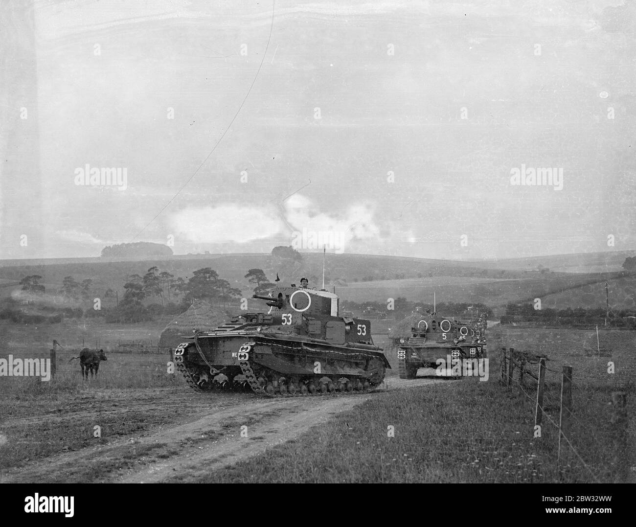 Vickers Medium tanks going into action during British army manoeuvres at Salisbury . Tanks going into action on Salisbury Plain , Wiltshire , during the British Army summer manoeuvres . 16 August 1932 . Stock Photo