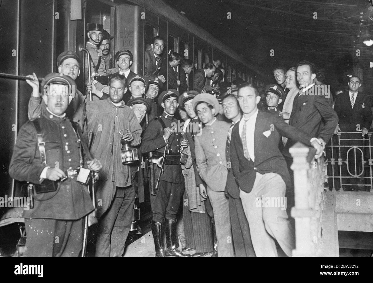 Spanish deportees go into exile . A number of men , most of them members of aristocratic families , who were concerned in the recent uprising in Spain , were deported to exile in the Ville de Cisneros in Spanish West Africa . The scene at the station in Madrid as the deportees train left . A strong guard was maintained at the station . 16 September 1932 Stock Photo