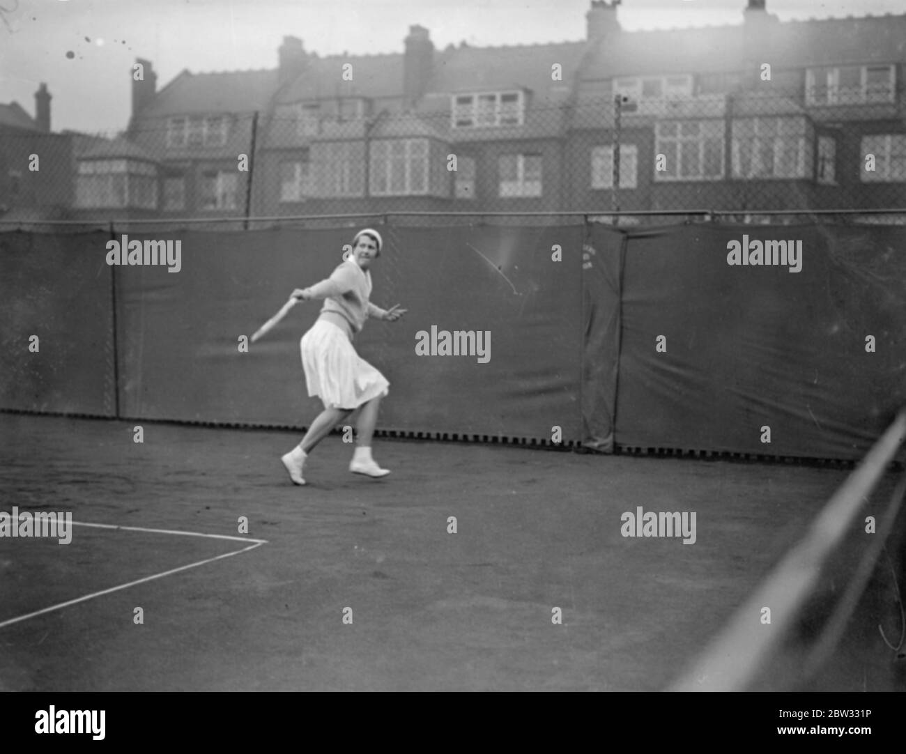 Hampstead hard courts tennis tournament opens . The Hampstead hard courts tennis tournament opend in brilliant weather . Miss Caldwell playing a backhand shot during the tournament . 21 March 1932 Stock Photo