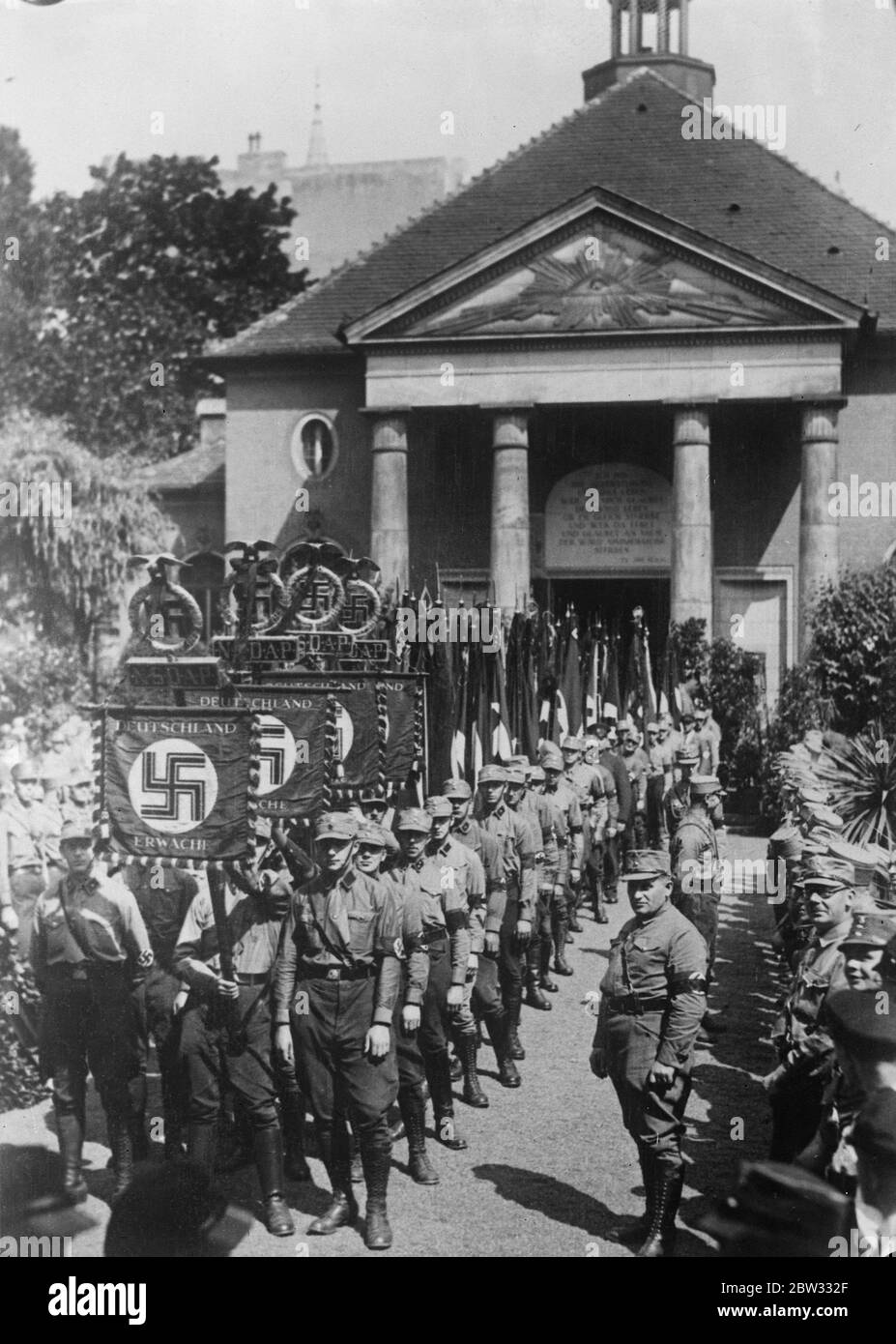 Nazi victim of Berlin riots has imposing funeral . The imposing funeral procession leaving the Friedhof Chapel in Berlin when Hellmut Koster , a Nazi victim of the Berlin Nazi - Communist riots was buried with full honours . 28 June 1932 Stock Photo