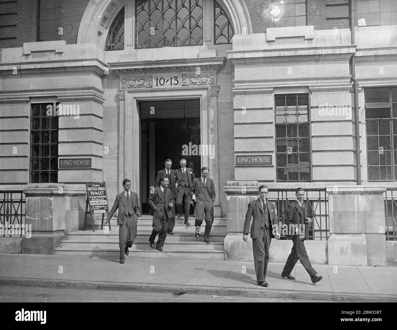 Bank of England opens secret branch for war loan work . The Bank of England has opened magnificent new premises in a great new building called Ling House , in South Street , near Finsbury Square , London , to cope with the rush of War loan conversions . The Bank has more than 250 clerks in the new temporary quarters . Clerks going out for tea , before carrying on through the evening on their rush job , at Ling House . 21 July 1932 Stock Photo