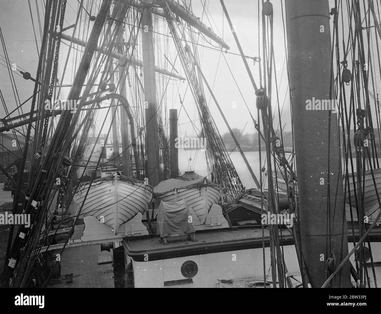 Olivebank a forest of spars and ropes in the Thames . A forest of Spars and ropes , in the Thames , as the four masted barque Olivebank which has just arrived at Mill Wall Dock , in the Thames with grain is unloaded . 15 August 1932 . Stock Photo