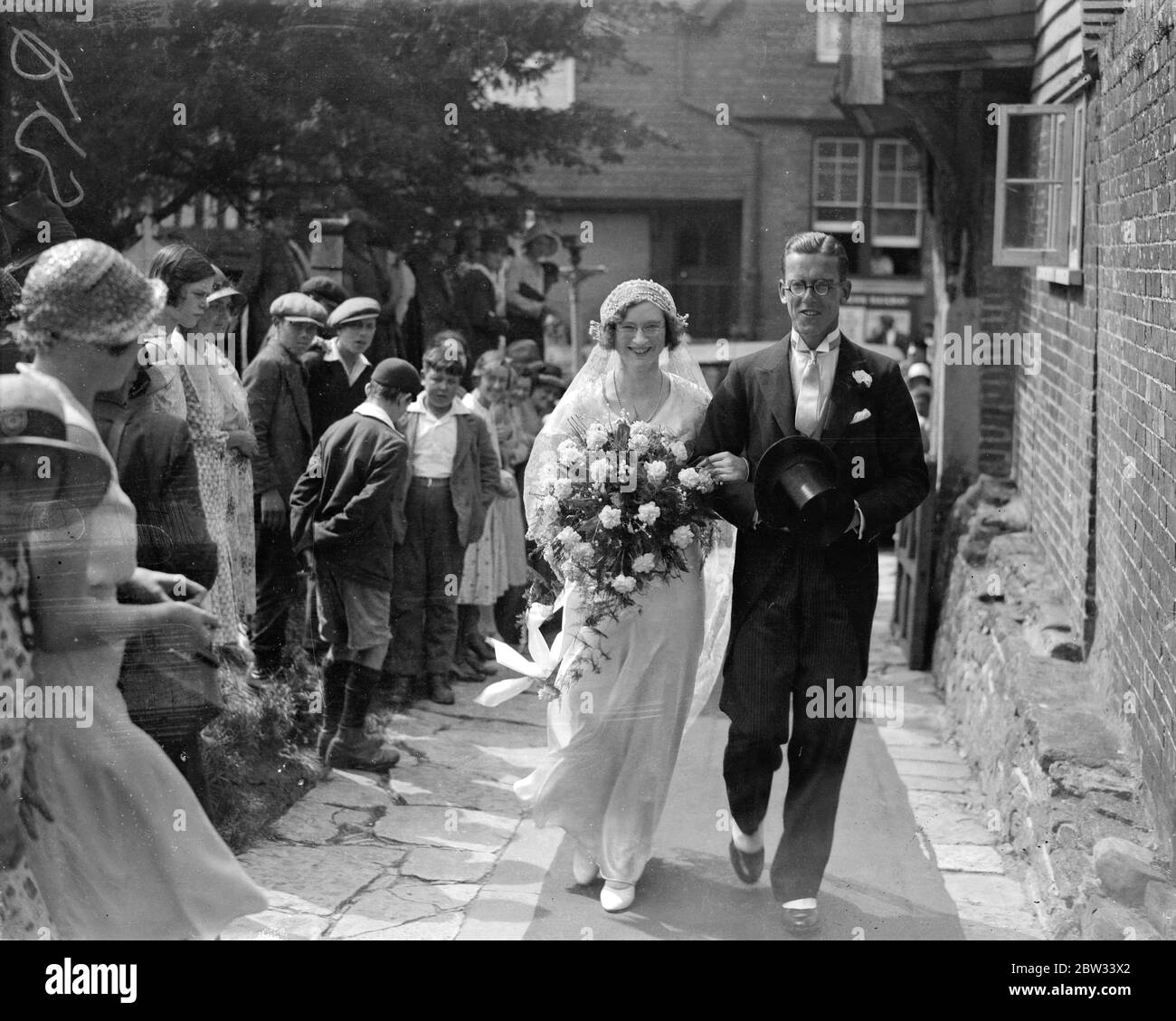 Heiress with veto on marriage acts as bridesmaid to her sister at staplehurst wedding . Miss Marjorie Clementson , daughter of the Rector of Staplehurst , Kent , who was left a large fortune providing she did not marry acted as a bridesmaid to her sister , Miss Vera Clementson , at her wedding to Major A Simkins , at Staplehurst Parish Church . Mr Bernard Thorp , Miss Clementson ' s fiance , acted as usher . The bride and groom ( on right 0 with Miss Marjorie Clementson the bridesmaid and her fiance Mr Bernard Thorp pf Manchester who acted as usher , after the wedding . 8 August 1932 Stock Photo