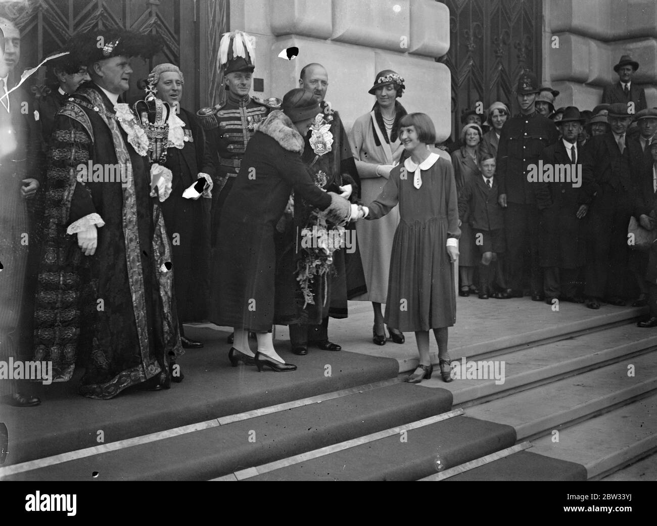 Lord Mayor opens Unilever House . The Lord Mayor , Sir Maurice Jenks , performed the opening ceremony of the Embankment Blackfriars the latest addition to London architecture . The Lady Mayoress recieiving a bouquet from Miss Beckett aged 15 the youngest employee , at the opening ceremony . 18 July 1932 Stock Photo