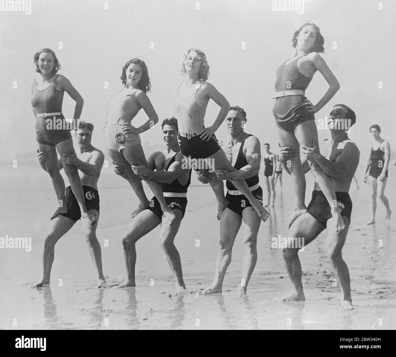 Preparing for the Olympic Games in the Californian sunshine . Men and women athletes preparing for the Olympic Games this summer , on the Santa Monica Beach , California , a favourite resort for Olympic athletes . 16 April 1932 Stock Photo