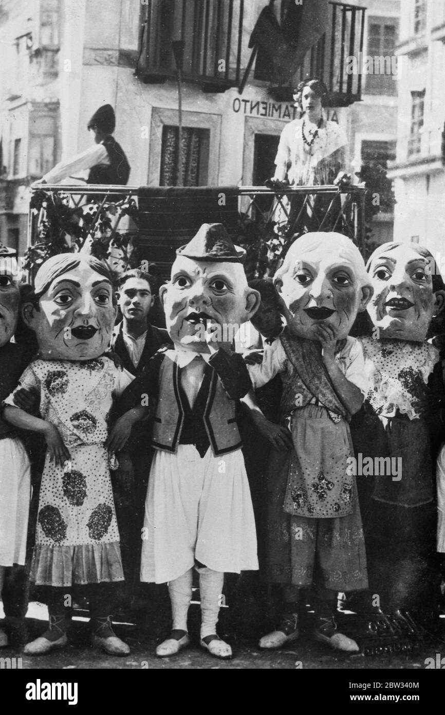 Grotesque figures greet President of Spain on state visit to Murcia . President Aleala Zamora , of Spain was greeted with much enthisiasm when he paid an official visit to Murcia . Residents in fancy dress costumes and wearing grotesque faces greeting the President . 2 April 1932 Stock Photo