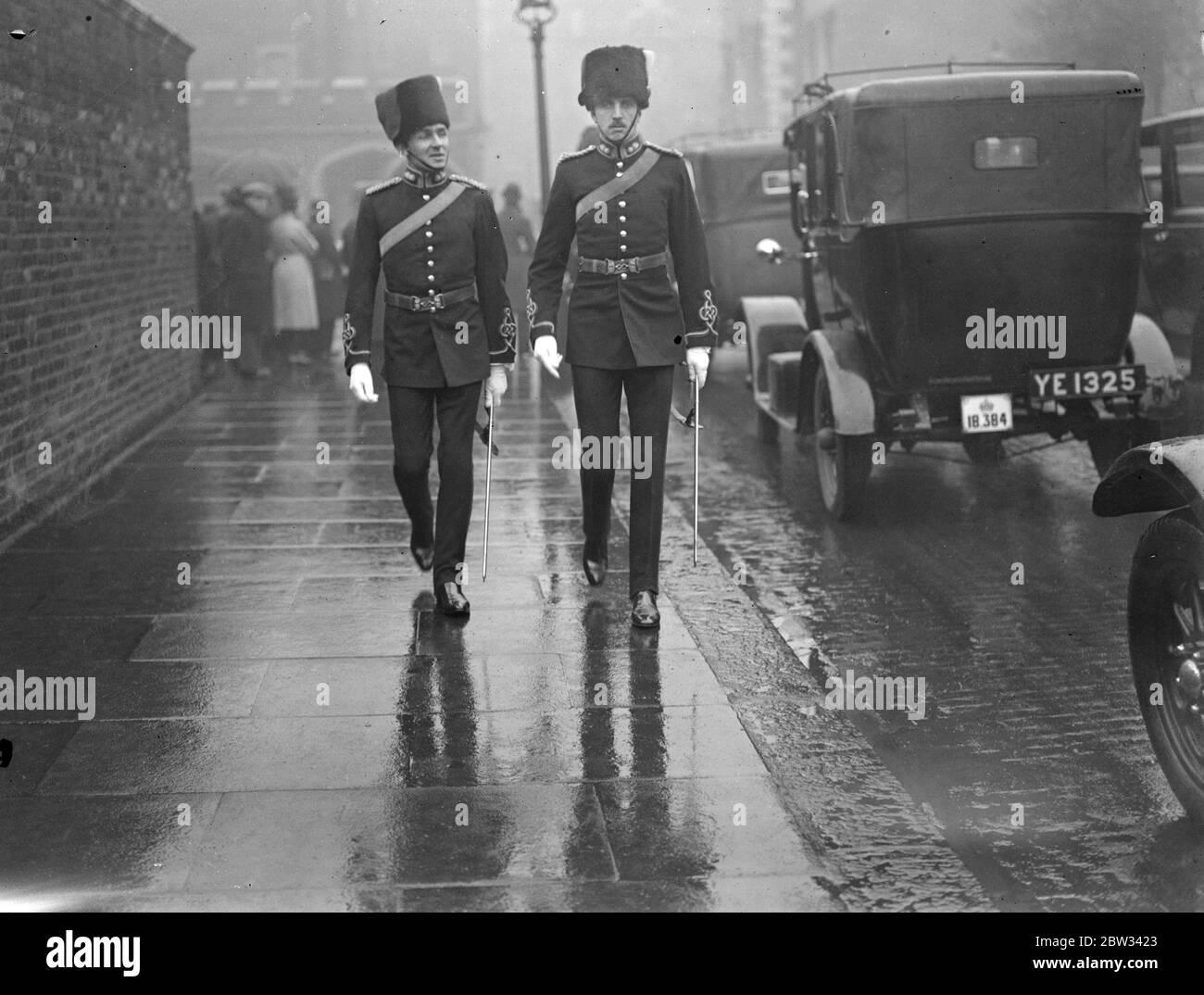 King holds levee at St James Palace . The King held the first levee of the season at St James Palace , London . Capt R D Syor ( right ) and Major F R Barker leaving after the levee . 8 March 1932 Stock Photo