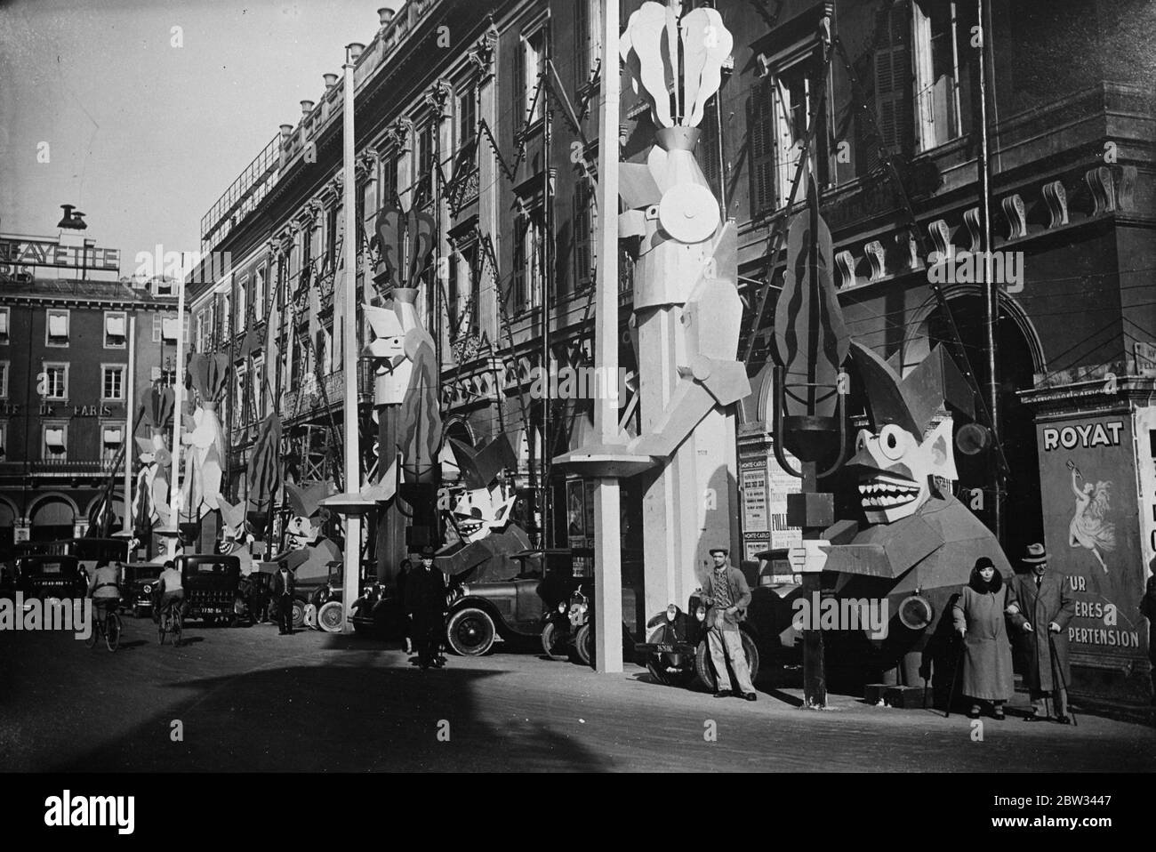 Decorated lamps and streets for Nice carnival . The streets in Nice , France , have been decorated in all kinds of peculiar images for the great Nice carnival . Curious images erected along the streets of Nice for the carnival . 9 February 1932 Stock Photo