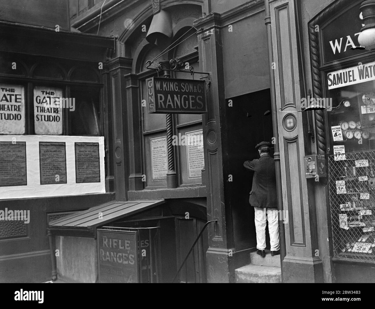 Man wounded two years ago again shot in Strand rifle range . Francis Richard Salt , part proprietor of a shooting gallery in Villiere Street , Strand , was found alone in the gallery shot in the back of the head . He was shot in the range two years ago . He was taken to Charing cross hospital where he is in a critical condition . The scene of the shooting , the shooting gallery in Villiers Street , London . 13 July 1932 Stock Photo