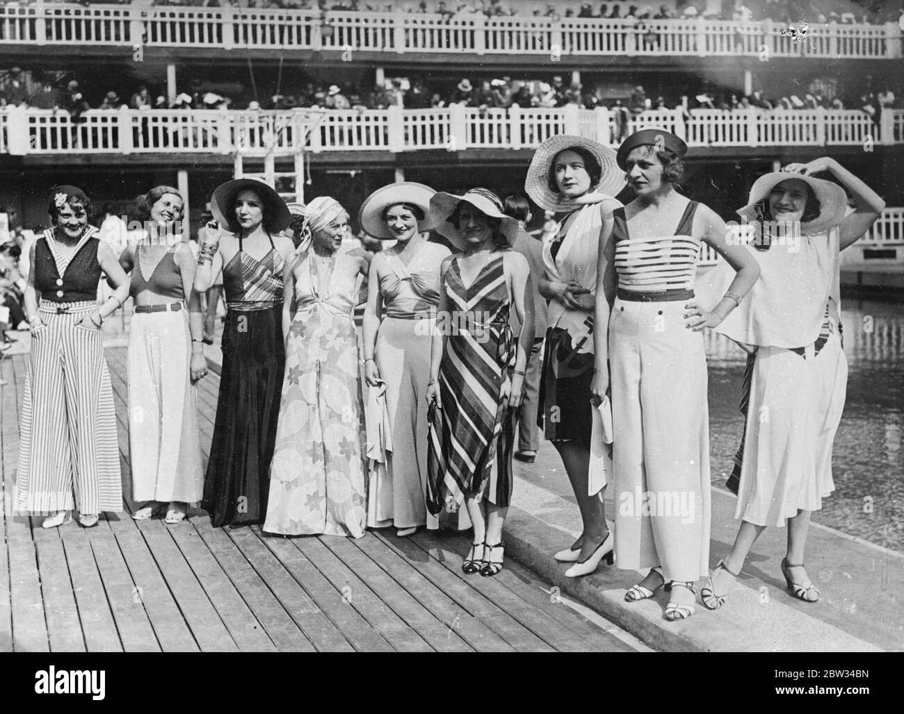 Daring bathing costumes shown at Paris parade . Some of the most daring bathing costumes ever evolved were shown at a parade of new bathing fashion at the Molitor Baths in Paris . Some of the new costumes seen during the parade . 21 June 1932 Stock Photo