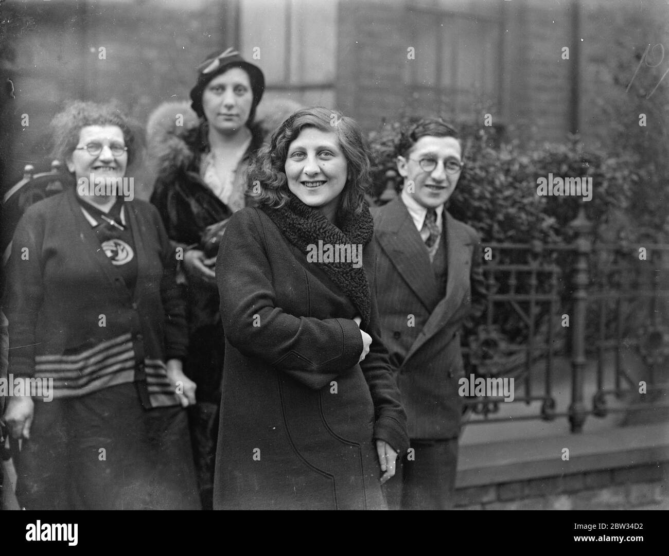 The first lucky Londoner in the Irish sweep . Mrs Sadi Spitzel of Chardmore Road , Clapton Common , London , was the first Londoner to draw a horse in the Irish sweepstake for the Grand National race . She drew Gibus . She is the wife of an insurance agent . Mrs Sadi Spitzel with her husband a friends who hurried to congratulate her on her luck . 14 March 1932 Stock Photo