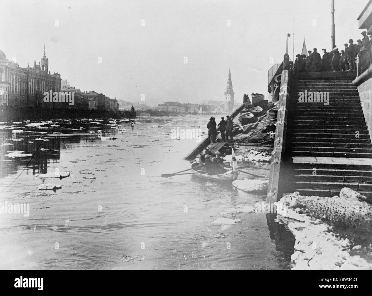 The ice begins to break in Moscow . Day and night guard in case of flooding . The ice in the river Moskva , has broken and the embankments are guarded day and night to warn inhabitants against the danger of flooding , caused by the swelling of the rivers by the melting ice . Melting ice flowing down the river Moskva in Moscow . 26 April 1932 Stock Photo