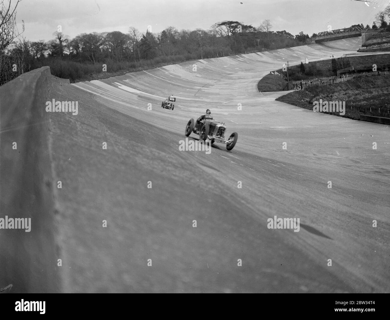 All out for the British Empire Trophy Race at Brooklands . Competitors all out in the race for the British Empire Trophy , at the Brooklands Track , Wetbridge , Surrey . 30 April 1932 Stock Photo
