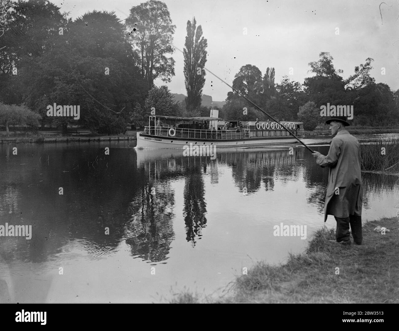 An angler ' s paradise at Pangbourne . Hundreds of fisherman of all ages took part in a great festival , on the river Thames at Pangbourne , Berkshire . Reflections in the river as a steamer passes by and an angler waits for a catch . 24 July 1932 Stock Photo