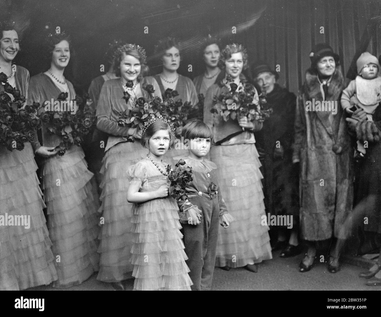 A study in expression at Lord Stanley ' s wedding . The small daughter of Mrs Maurice Lubbock , sister of the bridegroom , and the little page , who is the son of Lady Kathleen Stanley , were full of wonder at the splendour of the wedding ceremony as they left Southwark Cathedral , London , after acting as bridal attendants at the wedding of Lord Stanley of Alderly to Lady Audrey Chetwynd Talbot , daughter of Lady Winifred Pennoyer and the late Lord Ingestre . 3 March 1932 Stock Photo