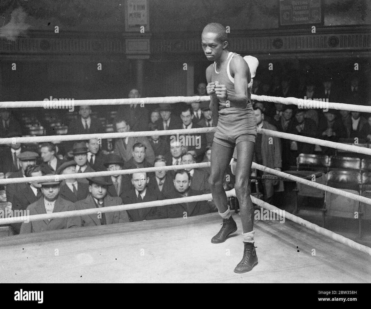 AL brown trains at the ring in London . Al Brown , the world ' s bantam champion trained at the Ring , London , for his fight with Johnny Peters . Admirers surround Al Brown during his training . 4 March 1933 Stock Photo
