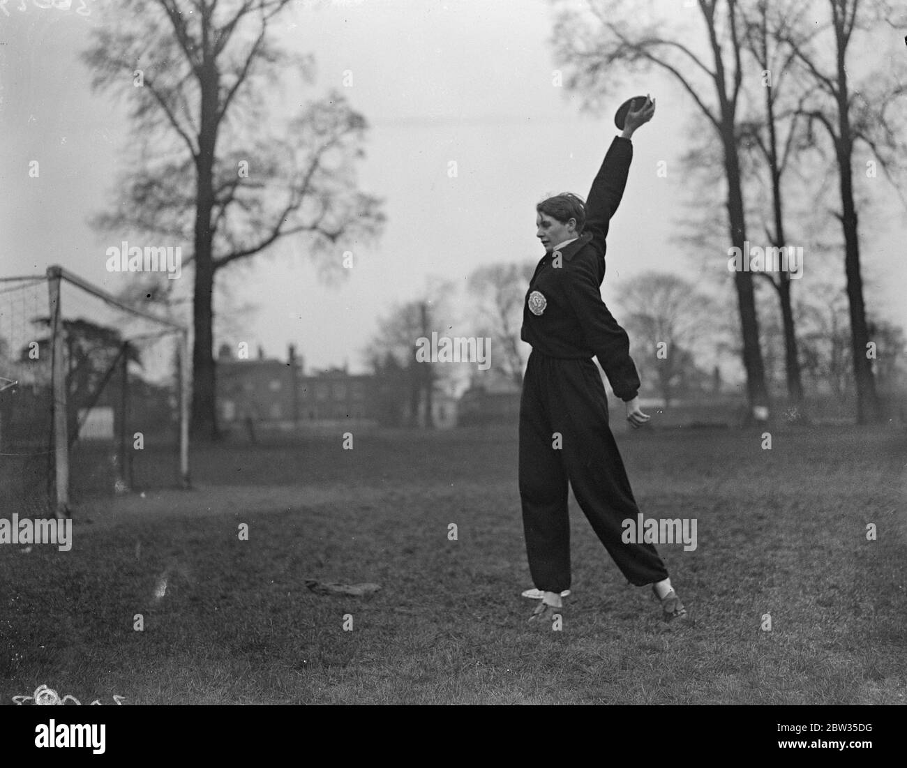Champion woman hurdler practices at Mitcham . Miss Kathleen Tiffin , the champion woman hurdler , with Miss Beatrice Proctor , were out at Mitcham , Surrey , practicig for the coming summer championship . 26 February 1933 Stock Photo