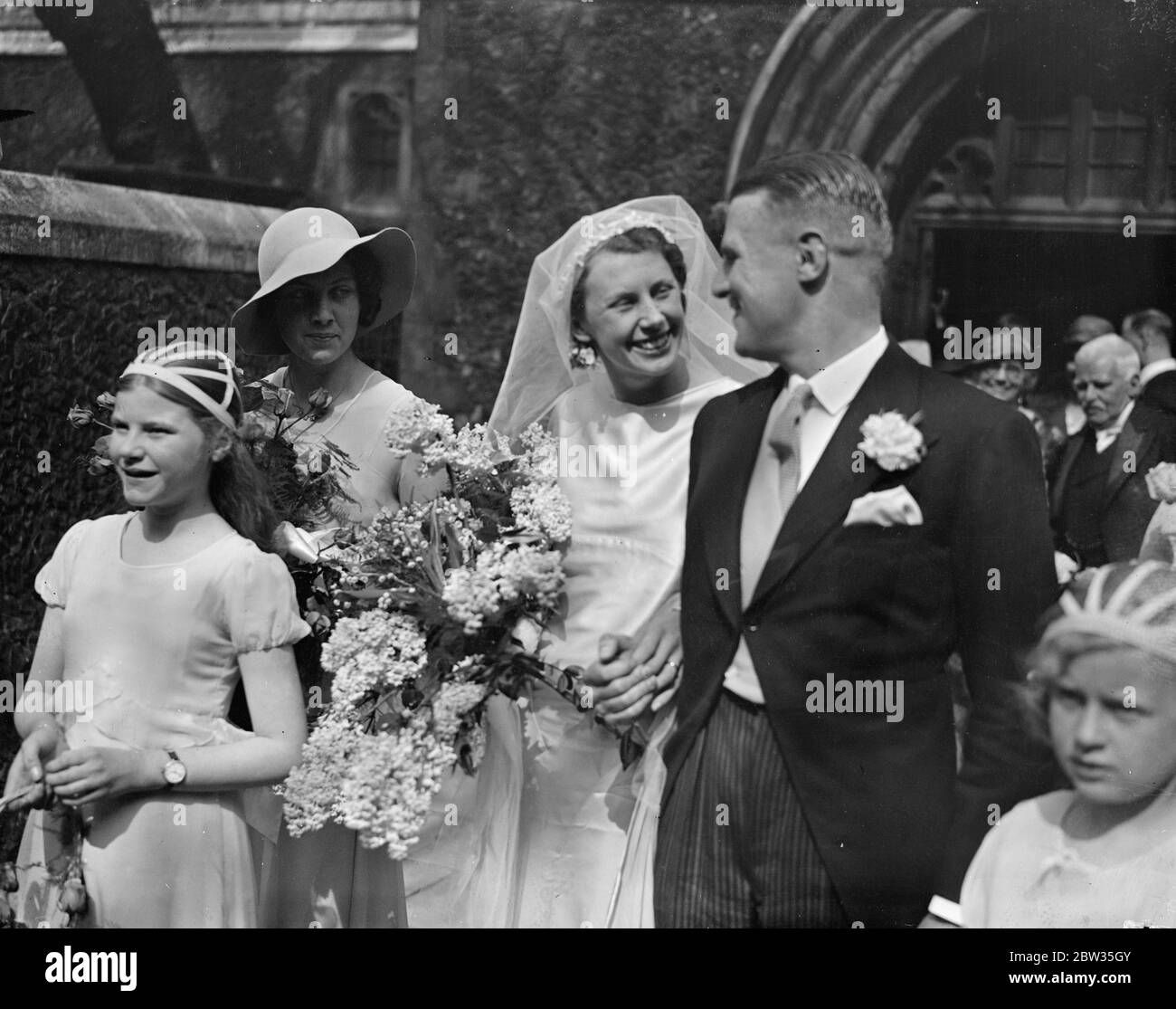 Dr J S Knox Weds Miss Norwood East at city church . The marriage between Dr John Stuart Knox and Miss Joan Norwood East took place at the Priory Church , St Bartholomew the Great , E C . The bride and groom after the ceremony . 27 April 1933 Stock Photo