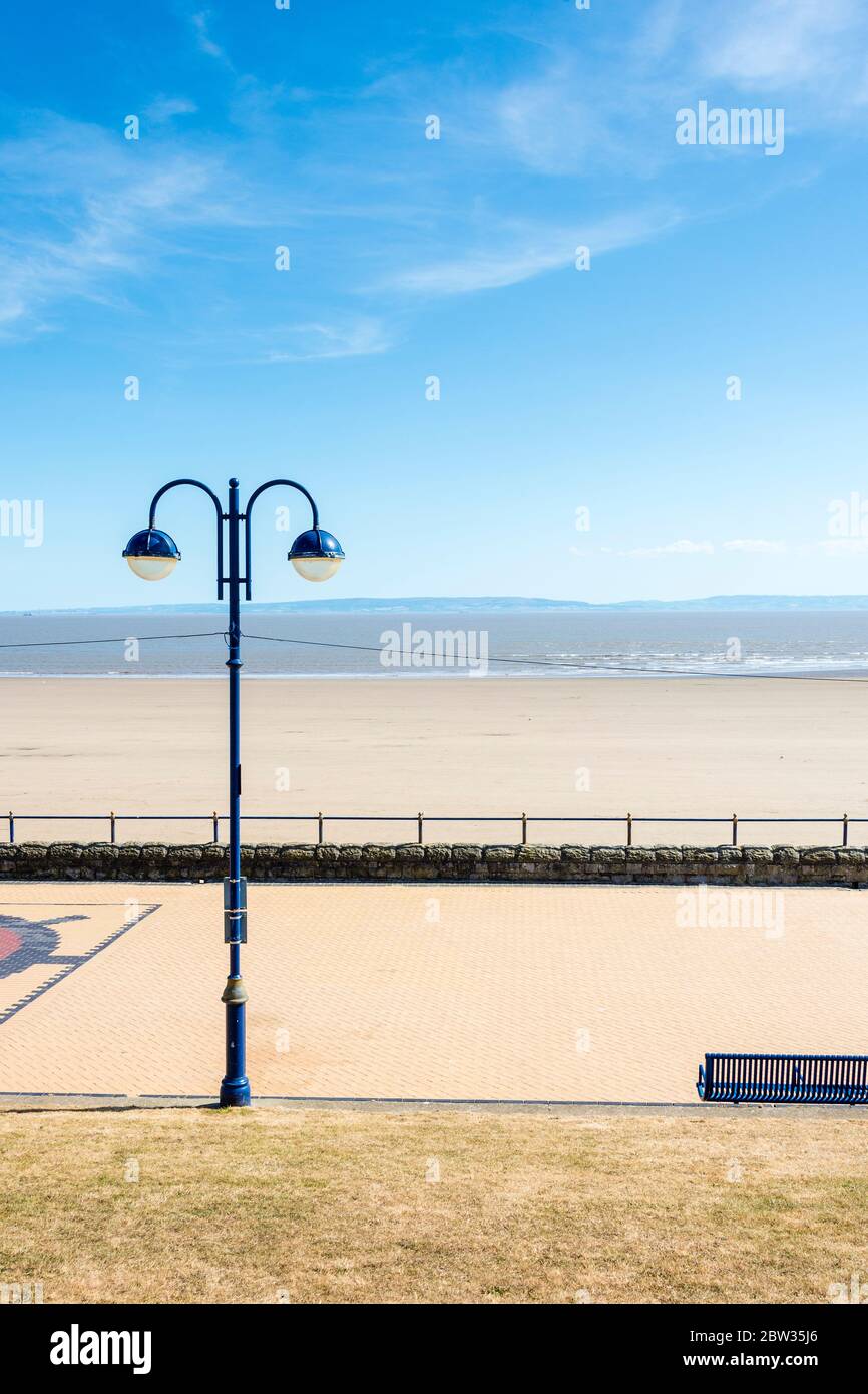 The promenade and beach at Barry Island are empty on a sunny Spring Bank holiday afternoon during the 2020 coronavirus crises. Stock Photo
