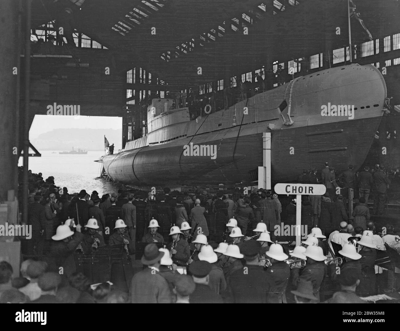The new British submarine launched . The new submarine HMS Starfish (19S) was a Group one British S class submarine and was launched at Chatham dockyard by the Mayooress of Gillingham , Mrs S C Summers . The submarine is 187 feet long , with a 24 feet beam and a displacement of 640 tons . The designer was Mr A W Johns CB , CBE , Director of Naval COnstruction . The new submarine going down the slipway at the launching ceremony . 14 March 1933 Stock Photo