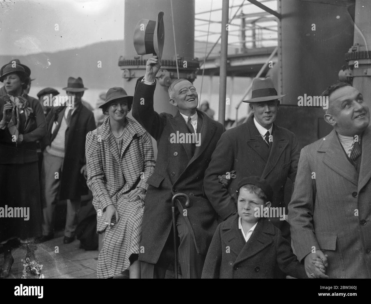 The American Ambassador to Britain arrives at Plymouth . Judge Robert Worth Bingham , the new American Ambassador to the Court of St James , arrived at Plymouth aboard the liner Washington en route for London . The new Ambassador , who is a wealthy man from Kentucky , is well known in American journalism . He is accompanied by his wife and daughter , and is bringing with him two cocker spaniels . Riding and hunting are his chief hobbies . Photo shows : Crowds welcoming the new American Ambassador , Mr Bingham , on arrival at Plymouth . 17 May 1933 Stock Photo