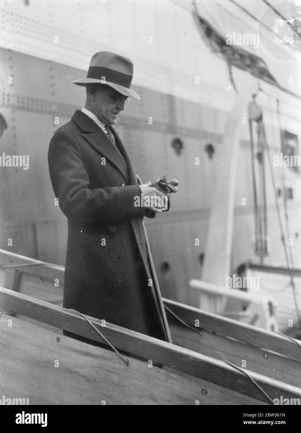 The American Ambassador to Britain arrives at Plymouth . Judge Robert Worth Bingham , the new American Ambassador to the Court of St James , arrived at Plymouth aboard the liner  Washington  en route for London . The new Ambassador , who is a wealthy man from Kentucky , is well known in American journalism . He is accompanied by his wife and daughter and is bringing with him two cocker spaniels . Riding and hunting are his chief hobbies . The new American Ambassador , Mr Bingham aboard the  SS Washington  , the new liner on arrival at Plymouth . 17 May 1933 Stock Photo