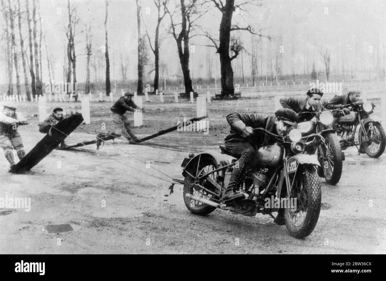 After aquaplaning comes ' terreplaning ' the latest sport to become popular in America . Riders are dragged along on boards by motorcycles . Photo shows , a terreplaning ' race in progress at Portland , Oregon . 1 April 1932 Stock Photo