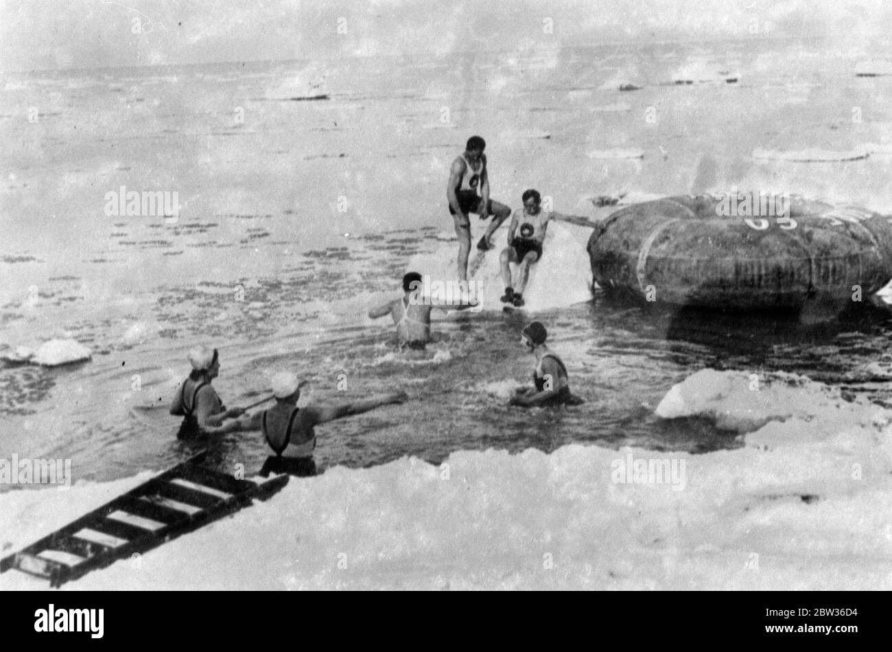Breaking the ice in Chicago . The first hardy bathers of the season broke the ice on the lake front in Chicago when they took the first swim of the year . Winter is just coming to an end in America ' s ' worst city ' . Photo shows , members of the polar bear club taking their first dip of the season in the ice covered waters of the lake . 29 March 1932 Stock Photo