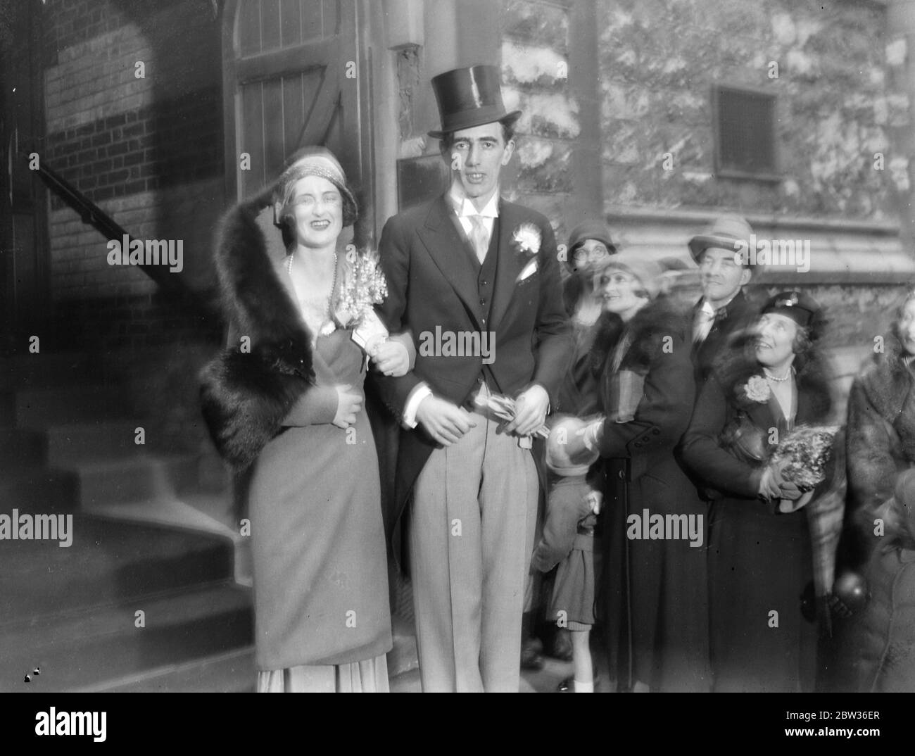 The wedding of Mr Geoffrey Towle , son of Mr Arthur Towle and assistant controller of the L M S group of hotels , was married at Christ Church , Down Street , London , to Miss Nancie Nielson , daughter of Mr W R Nielson , who is well known in racing and theatrical circles in the North of England . Photo shows , the bride and groom leaving the church after the ceremony . 23 January 1932 Stock Photo