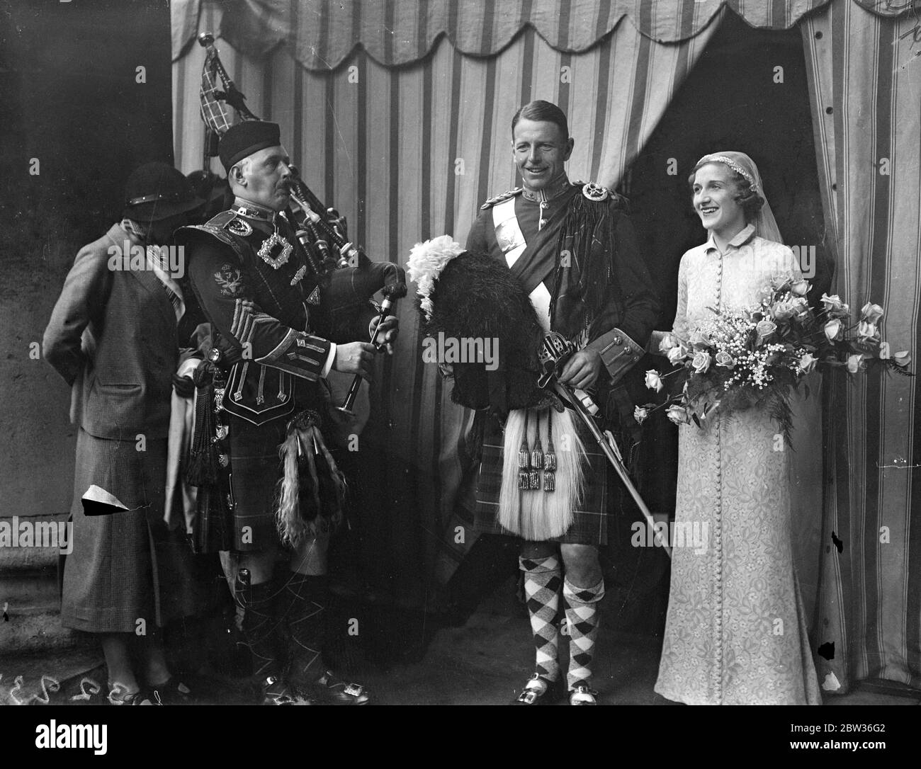 Seaforth Highlander at London wedding . Captain C P , Ronald Johnston of the Seaforth Highlanders was married to Miss Hermione Gray , daughter of Lieutenant Colonel Clive Gray , at St George ' s Church , Hanover Square , London . The bridegroom is the son of Lieutenant Colonel W J Johnston of Lesmurdie , Elgin , who wrote the wedding march played at the ceremony . Photo shows , the bride and groom being piped from the church . 15 November 1933 Stock Photo