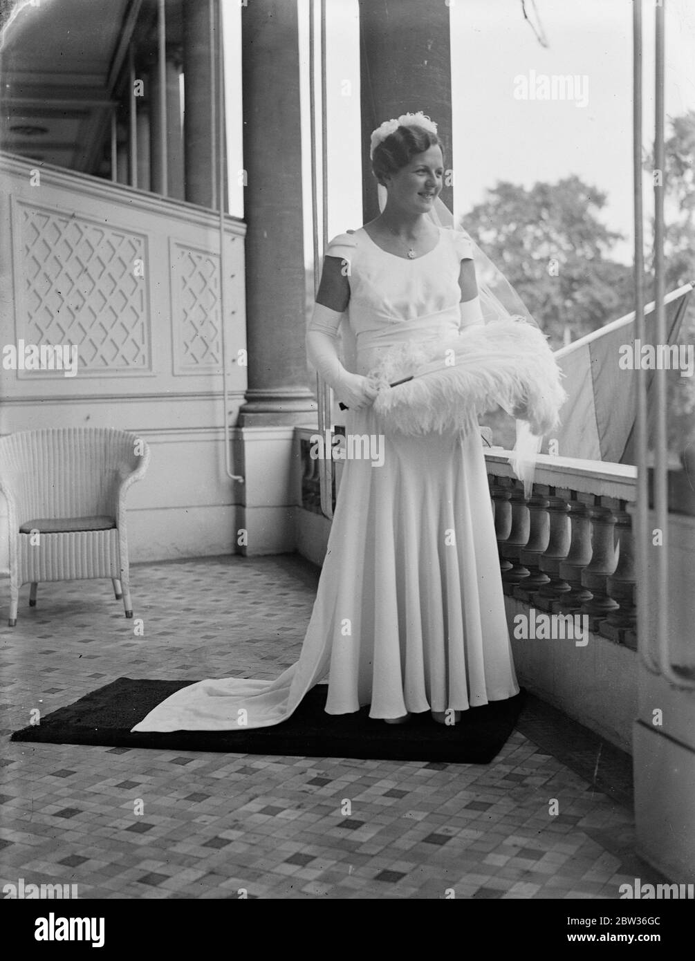 Betty Nuthall presented at Court . Betty Nuthall , the tennis player who is to take part in the Wimbledon Championships next week , was presented at the last Court of the Season at Buckigham Palace by Lady Crosfield , Photo shows : Miss Betty Nuthall in her Court gown . 23 June 1933 Stock Photo