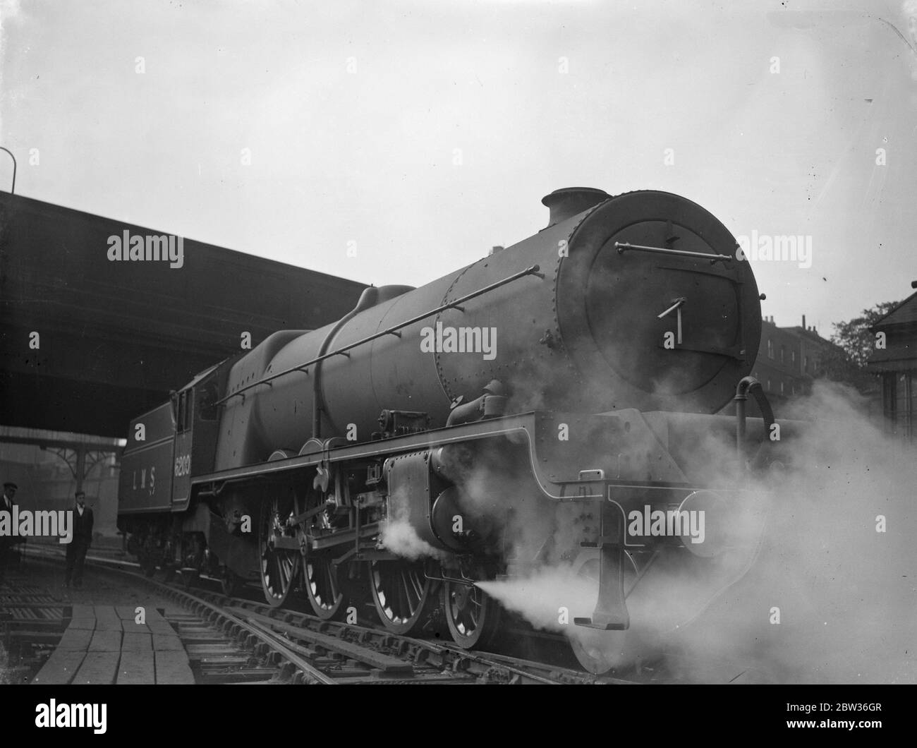 Britains most powerful passenger locomotive at Euston . The first of three giant new locomotives which constitute the most powerful express passenger type in Great Britain made its first appearance at Euston Station , London . The engine has been designed for duty on the heaviest Anglo Scottish expresses of the LMS . Photo shows , the new locomotive entering Euston Station , London . 28 June 1933 Stock Photo