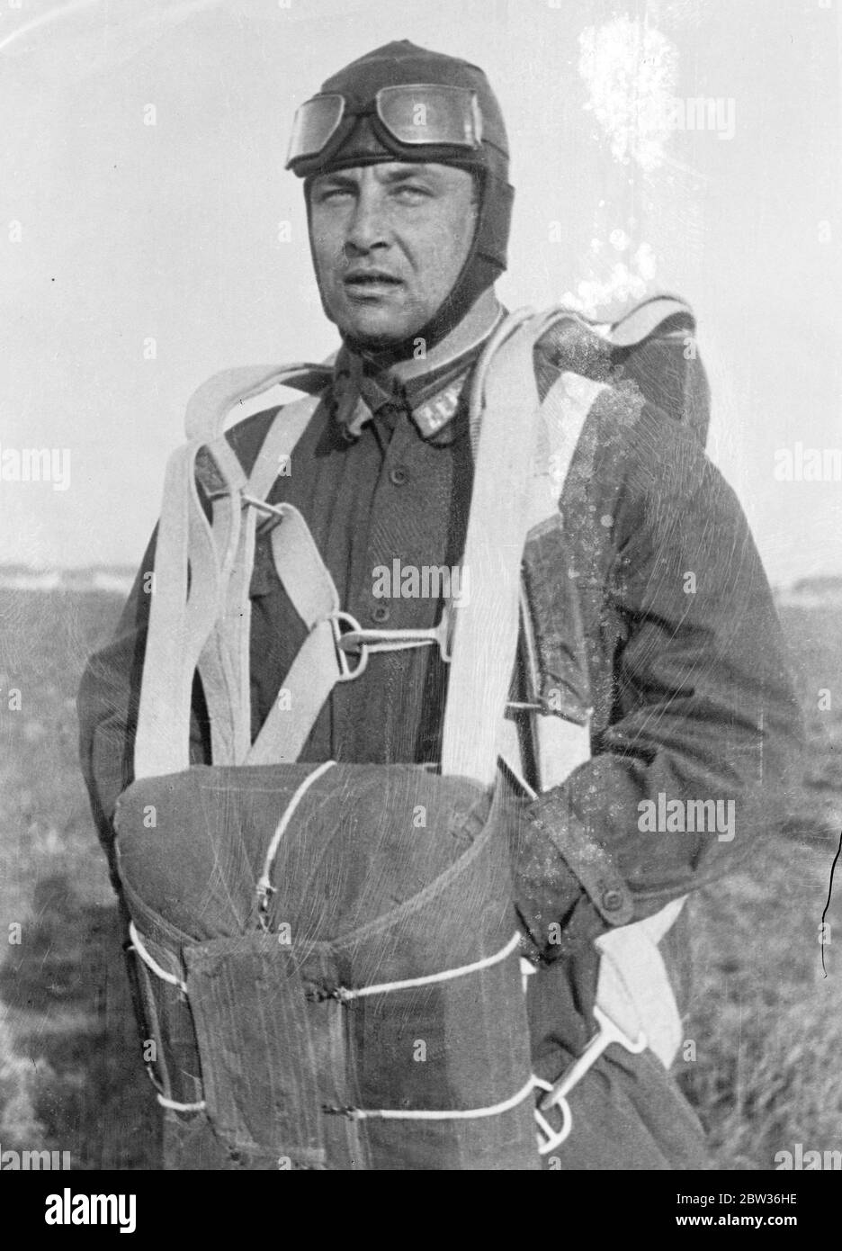 Russia claims world parachute record . The Russian parachute jumper Sabelin , who is claimed by the Soviet Government to have established a new world record , photographed on the Moscow aerodrome before going up for one of the spectacular leaps that have made him a national hero . 23 August 1933 Stock Photo