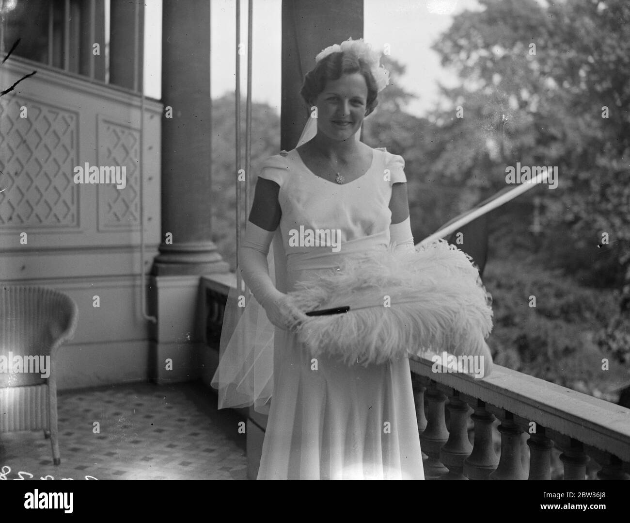 Betty Nuthall presented at Court . Betty Nuthall , the tennis player who is to take part in the Wimbledon Championships next week , was presented at the last Court of the Season at Buckigham Palace by Lady Crosfield , Photo shows : Miss Betty Nuthall in her Court gown . 23 June 1933 Stock Photo
