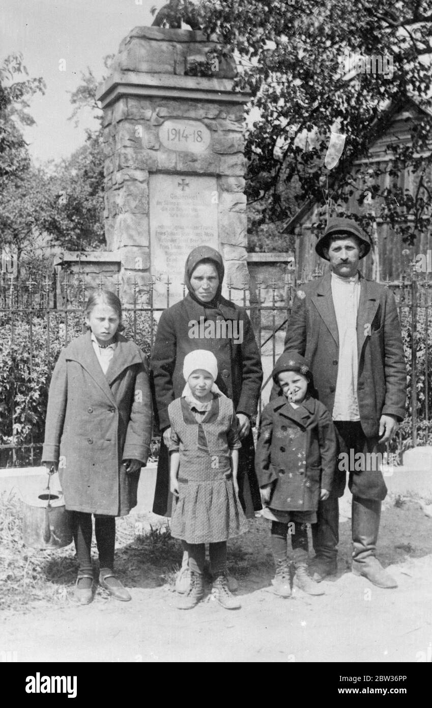 He disappeared at the beginning of the war , and now he has returned to find himself a hero with his name on the memorial . For years , Alois Kries , an Austrian has been a hero without knowing it . At the beginning of the war he was taken prisoner on the Russian front and spent years in a prison camp . There he married and became father of three children . On returning to his native town of Krems in Austria , he discovered that he had become a local hero with his name inscribed on the war memorial as having fallen in action . Photo shows ; Alois Kries with his Russian wife and three children Stock Photo