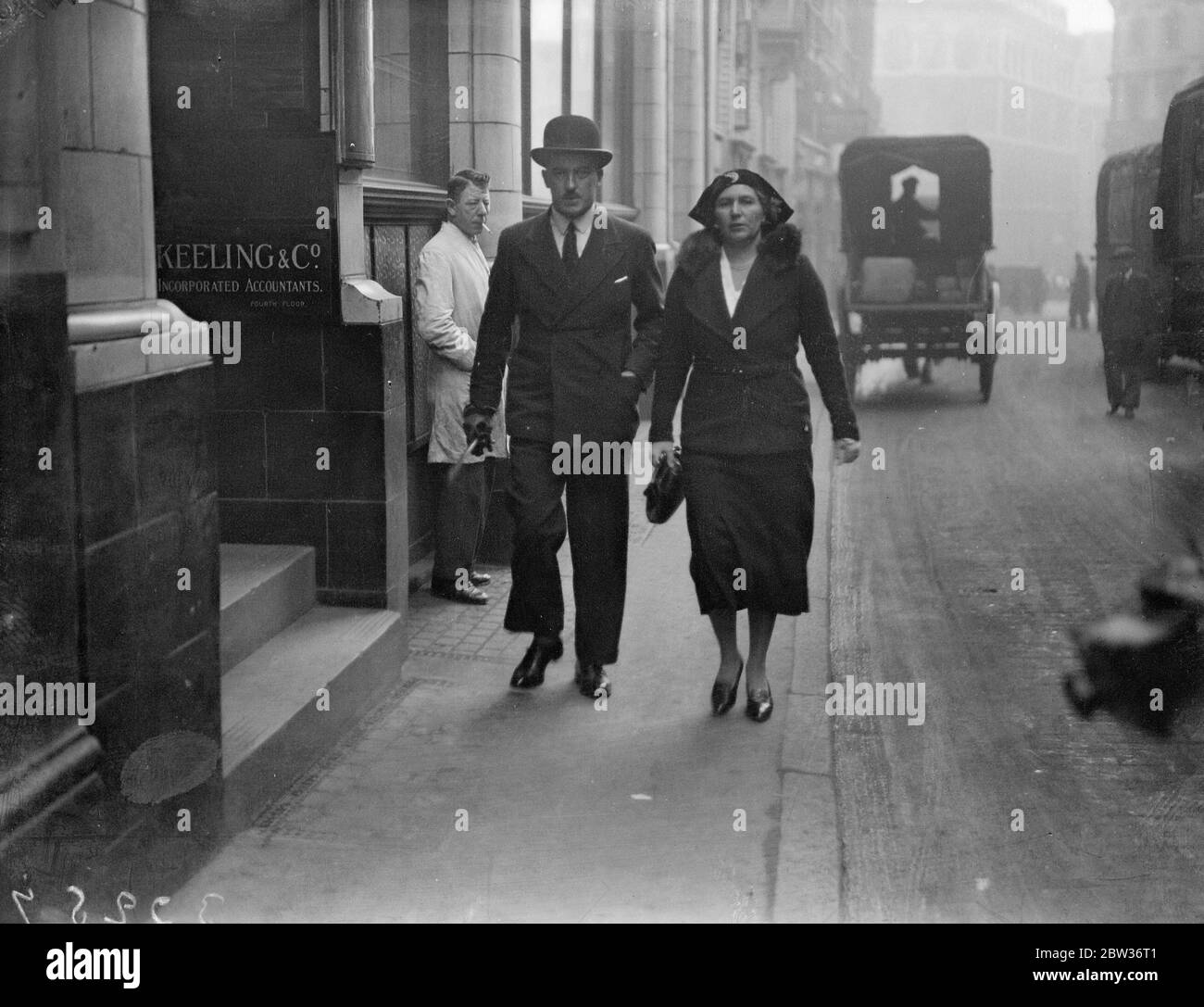London salvage chief goes to Bow Street police court . Captain Brynmor Eric Miles , head of the London Salvage Corps , who is accused of conspiring with Leopold Harris , head of the fire - raising gang , surrendered to his bail at Bow Street Police Court . Photo shows ; Captain Miles on his way to Bow Street for the hearing of the charges against him accompanied by his wife . 25 November 1933 Stock Photo