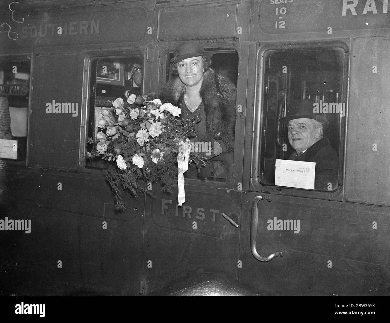 Ruth Draper off to South Africa . Miss Ruth Draper , the diseuse , was among the passengers who left Waterloo Station , London , on the Winchester Castle boat train for South Africa . Photo shows ; Ruth Draper in her carriage window at Waterloo Station before the departure of the boat train . 1 December 1933 Stock Photo