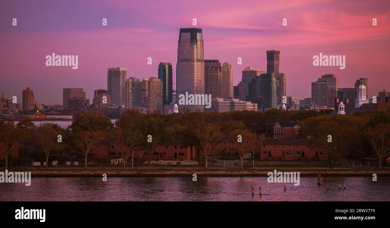 American East Cost. New Jersey State Jersey City Skyline During Scenic Sunrise. United States of America. Panoramic Photo. Stock Photo