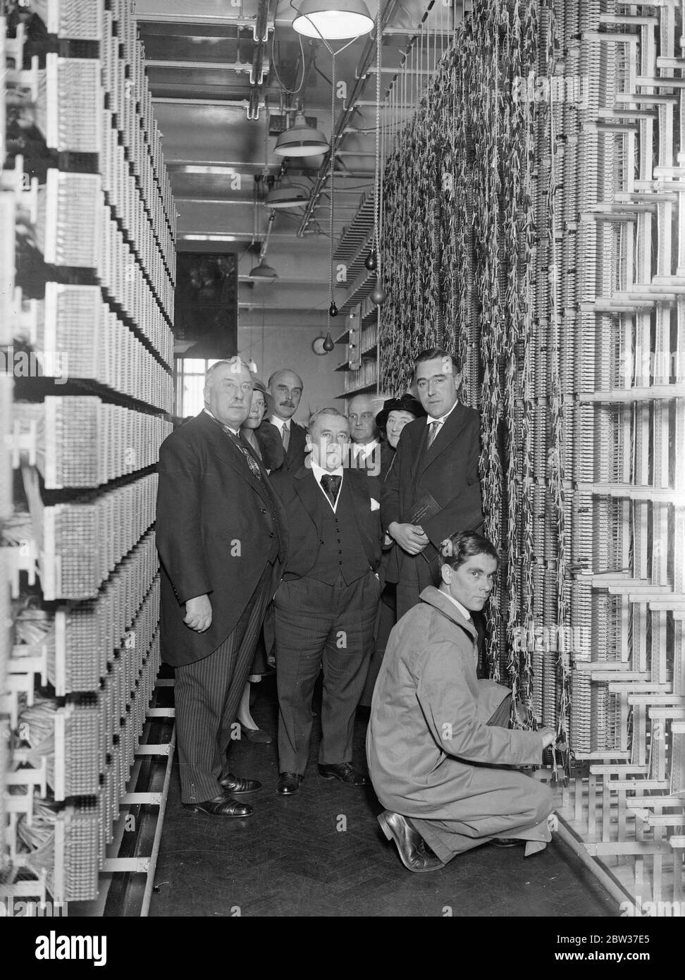 The Stamford Hill automatic telephone exchange , the 63rd automatic exchange to be brought into service within ten miles of Oxford Circus , was officially opened and more than 2 , 500 subscribers went over to the automatic system . The first call was made by Councillor M E James , chairman of Tottenham Urban council to his seven year old daughter Beryl , at school at Amhurst Park . Photo shows , left to right Sir Herbert J Ormond , J P , Mayor of Stoke Newington Mr WHU Napier , O B E , controller , London telephone service , and Councillor M E James , J P after ther opening ceremony . 22 March Stock Photo